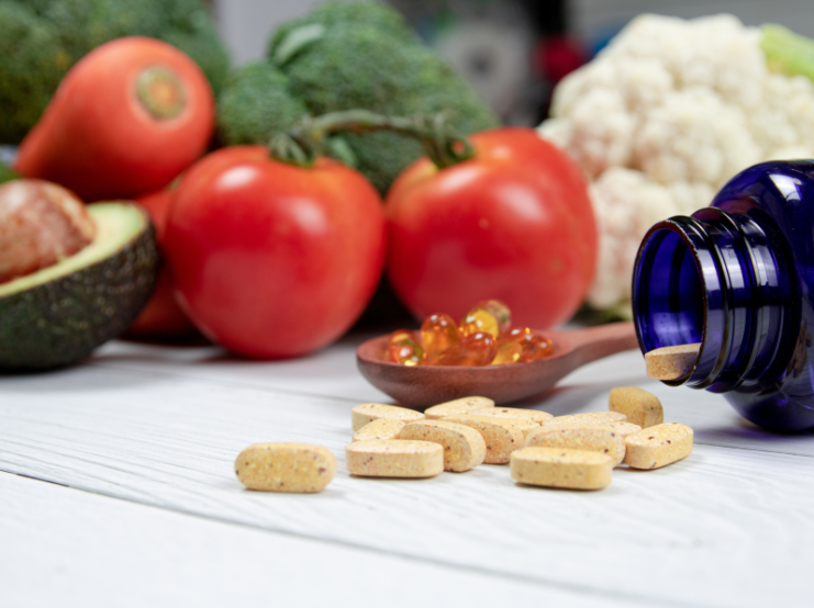 A photo of supplements & fish oils displayed on a table